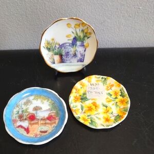 Three Bone China Plates with Floral Designs
